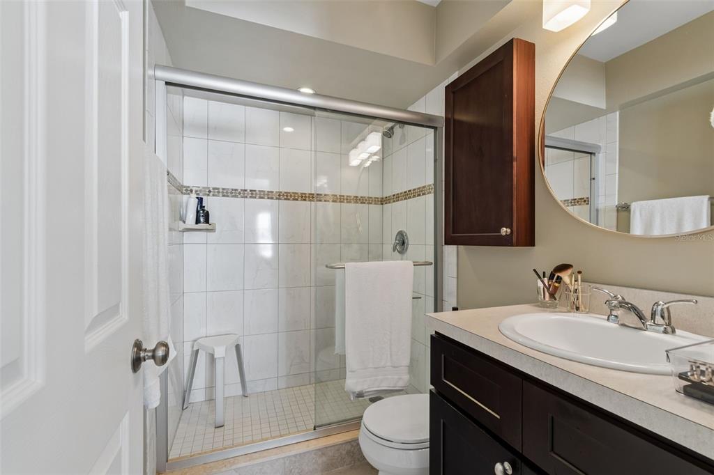 2307 Bay Boulevard Indian Rocks Beach, FL 33785 - Photo 14 of 85 a bathroom with a granite countertop sink toilet and shower