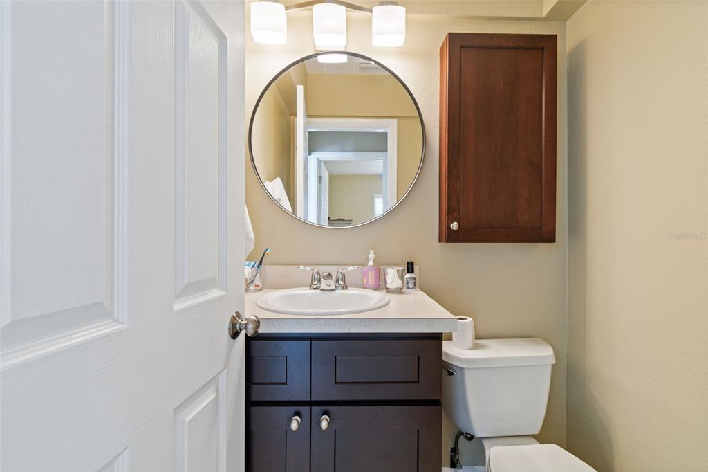2307 Bay Boulevard Indian Rocks Beach, FL 33785 - Photo 19 of 85 a bathroom with a toilet sink and mirror