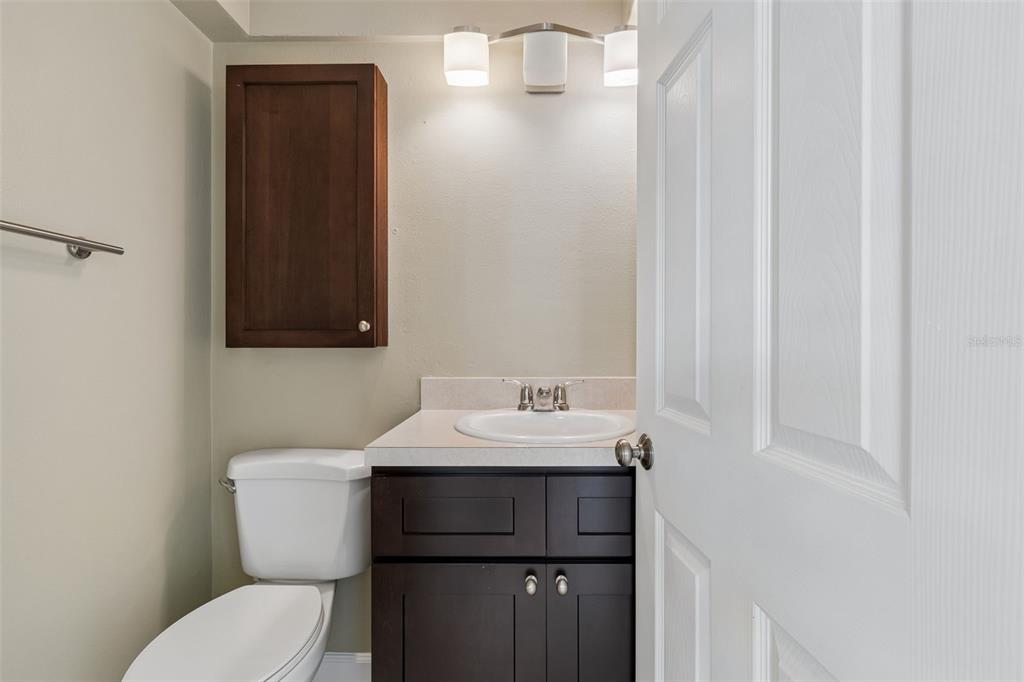 2307 Bay Boulevard Indian Rocks Beach, FL 33785 - Photo 42 of 85 a bathroom with a toilet sink and mirror