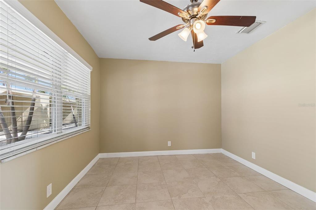 2307 Bay Boulevard Indian Rocks Beach, FL 33785 - Photo 45 of 85 an empty room with a window and a fan
