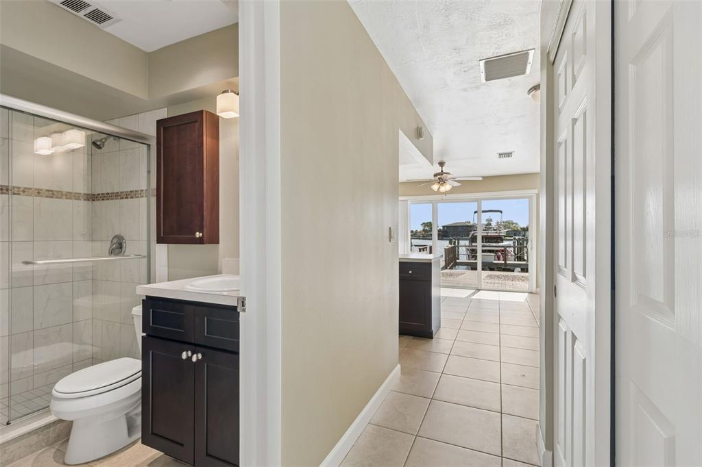 2307 Bay Boulevard Indian Rocks Beach, FL 33785 - Photo 46 of 85 a bathroom with a toilet a sink and mirror