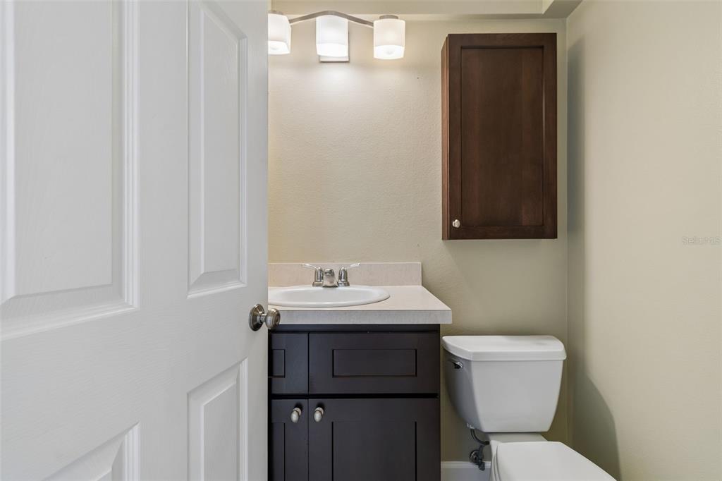 2307 Bay Boulevard Indian Rocks Beach, FL 33785 - Photo 56 of 85 a bathroom with a toilet sink and mirror