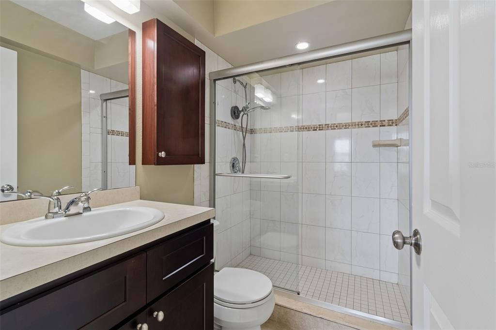 2307 Bay Boulevard Indian Rocks Beach, FL 33785 - Photo 64 of 85 a bathroom with a sink a toilet and shower