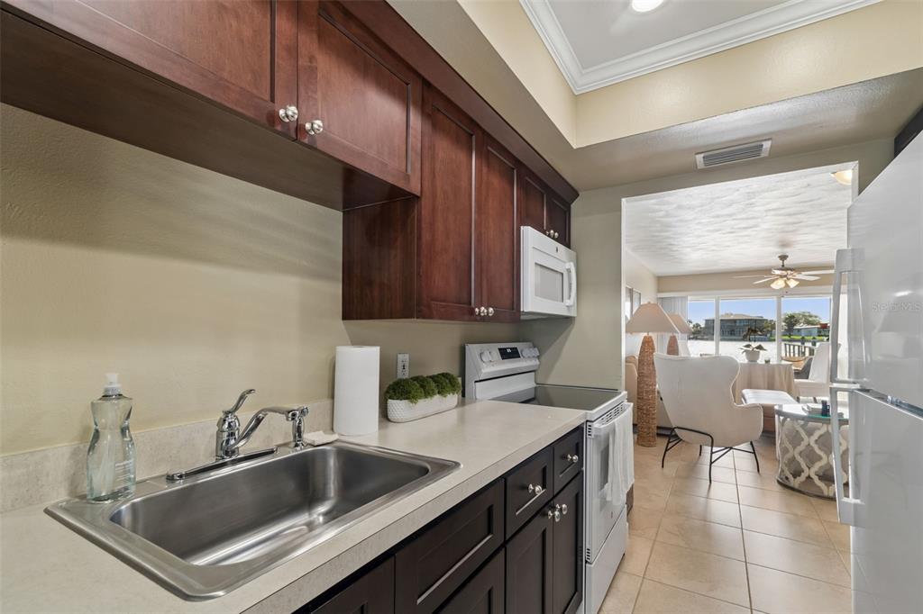 2307 Bay Boulevard Indian Rocks Beach, FL 33785 - Photo 7 of 85 a kitchen with a sink cabinets and counter space