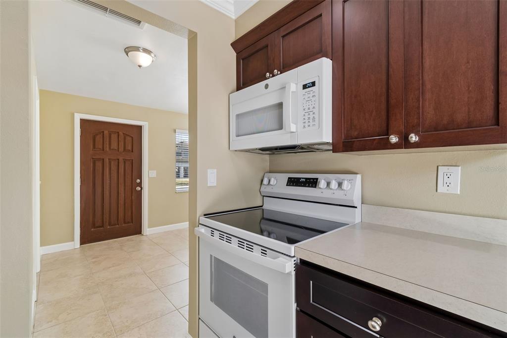 2307 Bay Boulevard Indian Rocks Beach, FL 33785 - Photo 71 of 85 a kitchen with a stove and a microwave