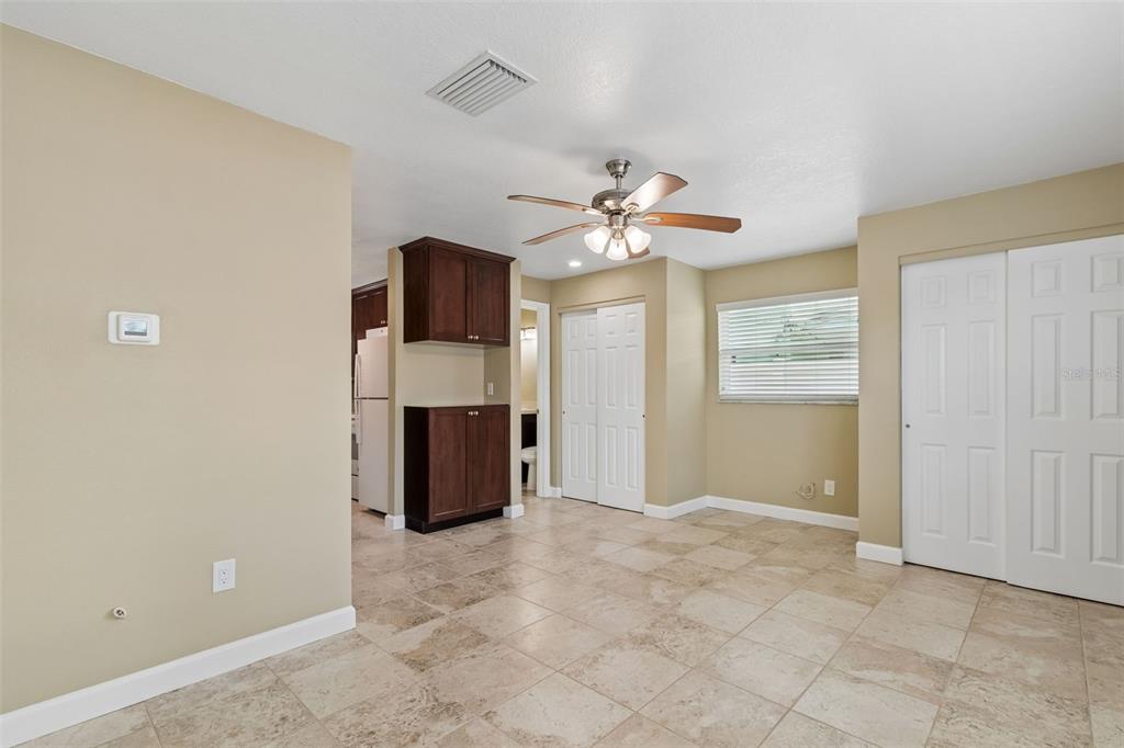 2307 Bay Boulevard Indian Rocks Beach, FL 33785 - Photo 77 of 85 a view of a livingroom with a chandelier fan and windows