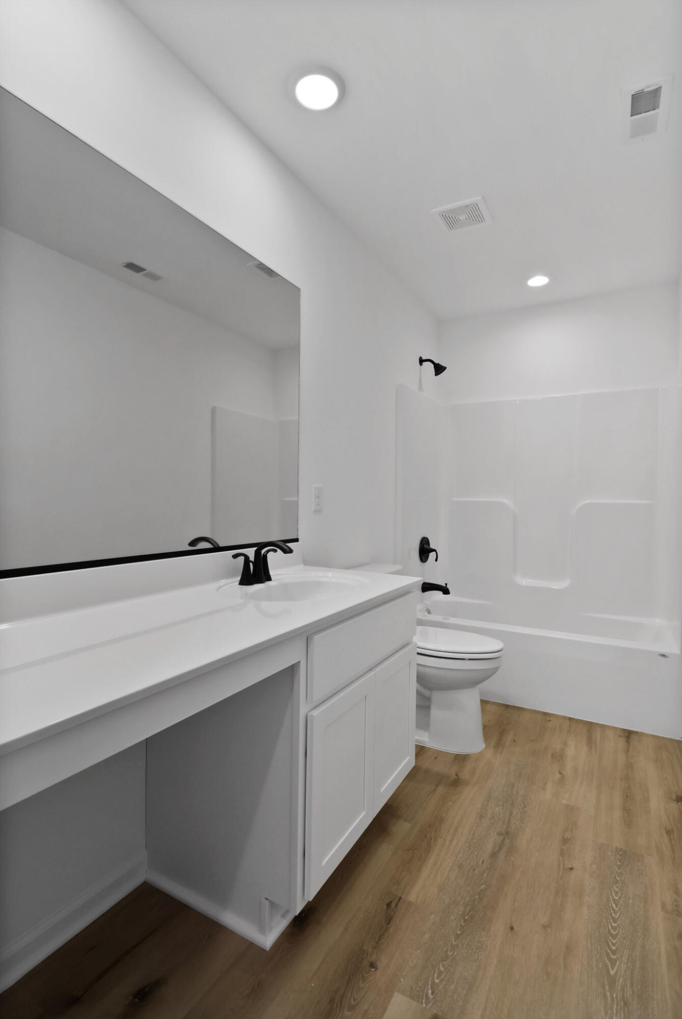 3111 Buck Lane Portage, IN 46368 - Photo 12 of 24 a bathroom with a sink a toilet and bathtub