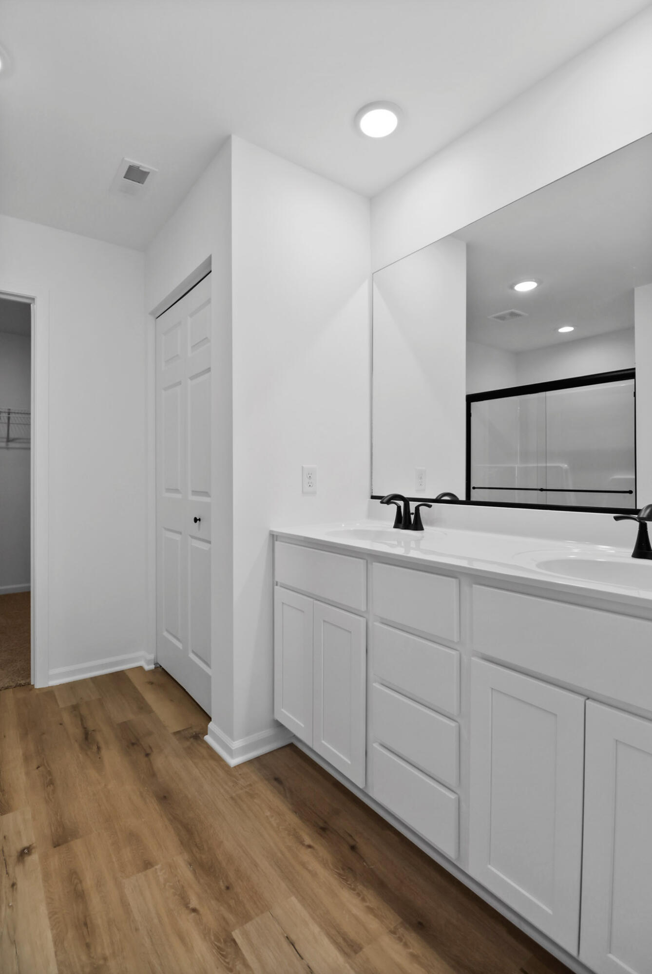 3111 Buck Lane Portage, IN 46368 - Photo 13 of 24 a bathroom with a double vanity sink and a mirror
