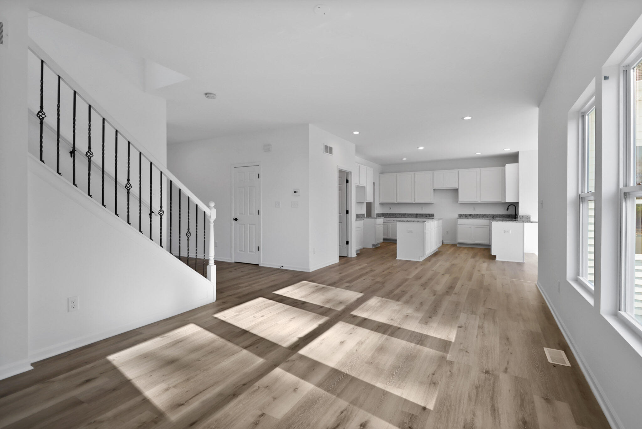 3111 Buck Lane Portage, IN 46368 - Photo 4 of 24 a view of a hallway with wooden floor and windows