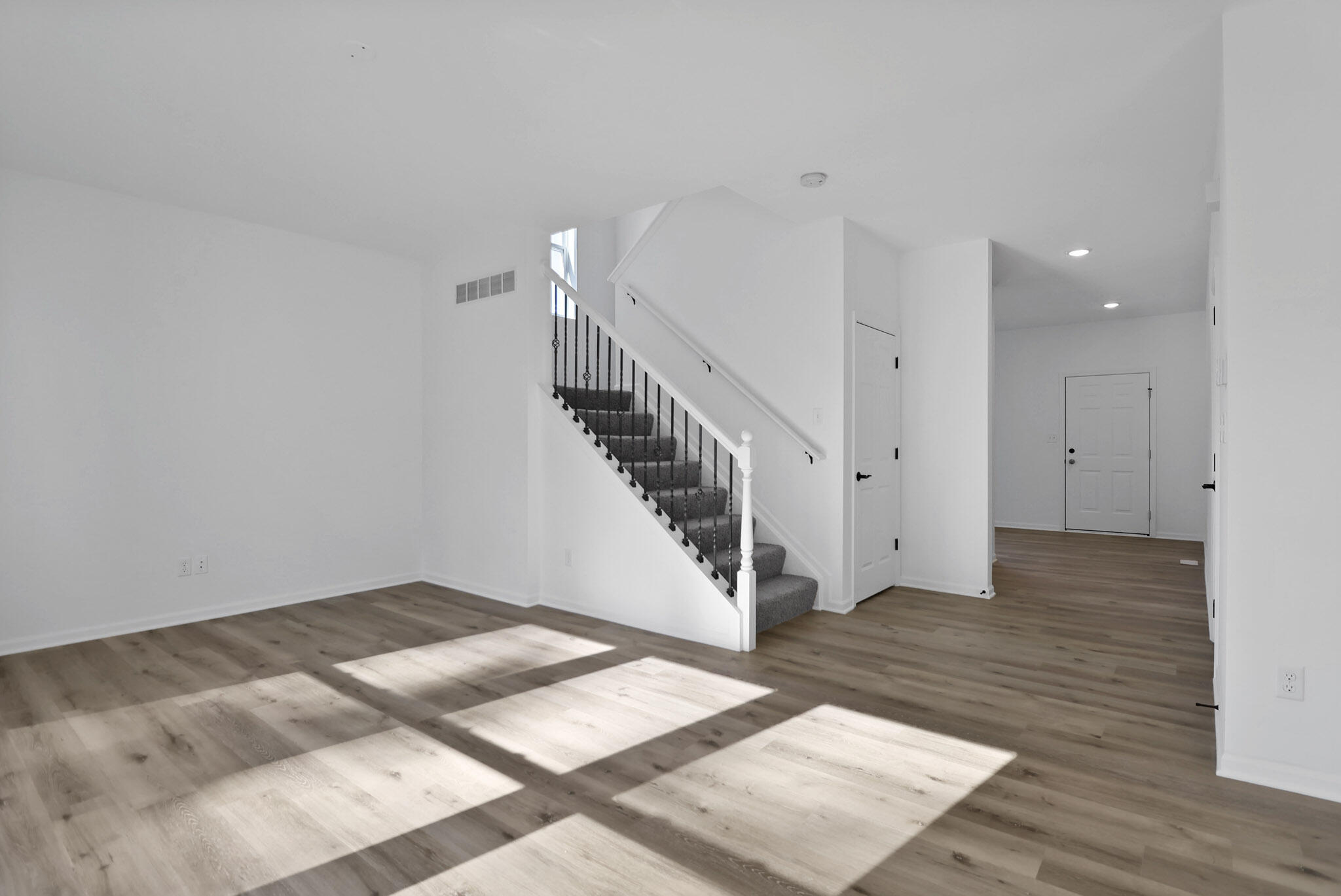 3111 Buck Lane Portage, IN 46368 - Photo 5 of 24 a view of an empty room with wooden floor and stairs