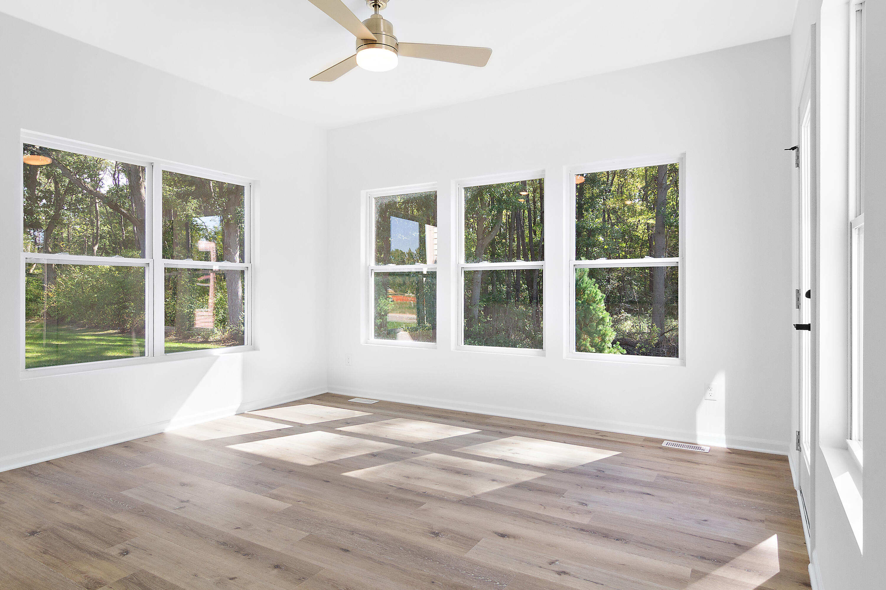 3111 Buck Lane Portage, IN 46368 - Photo 7 of 24 an empty room with wooden floor and windows
