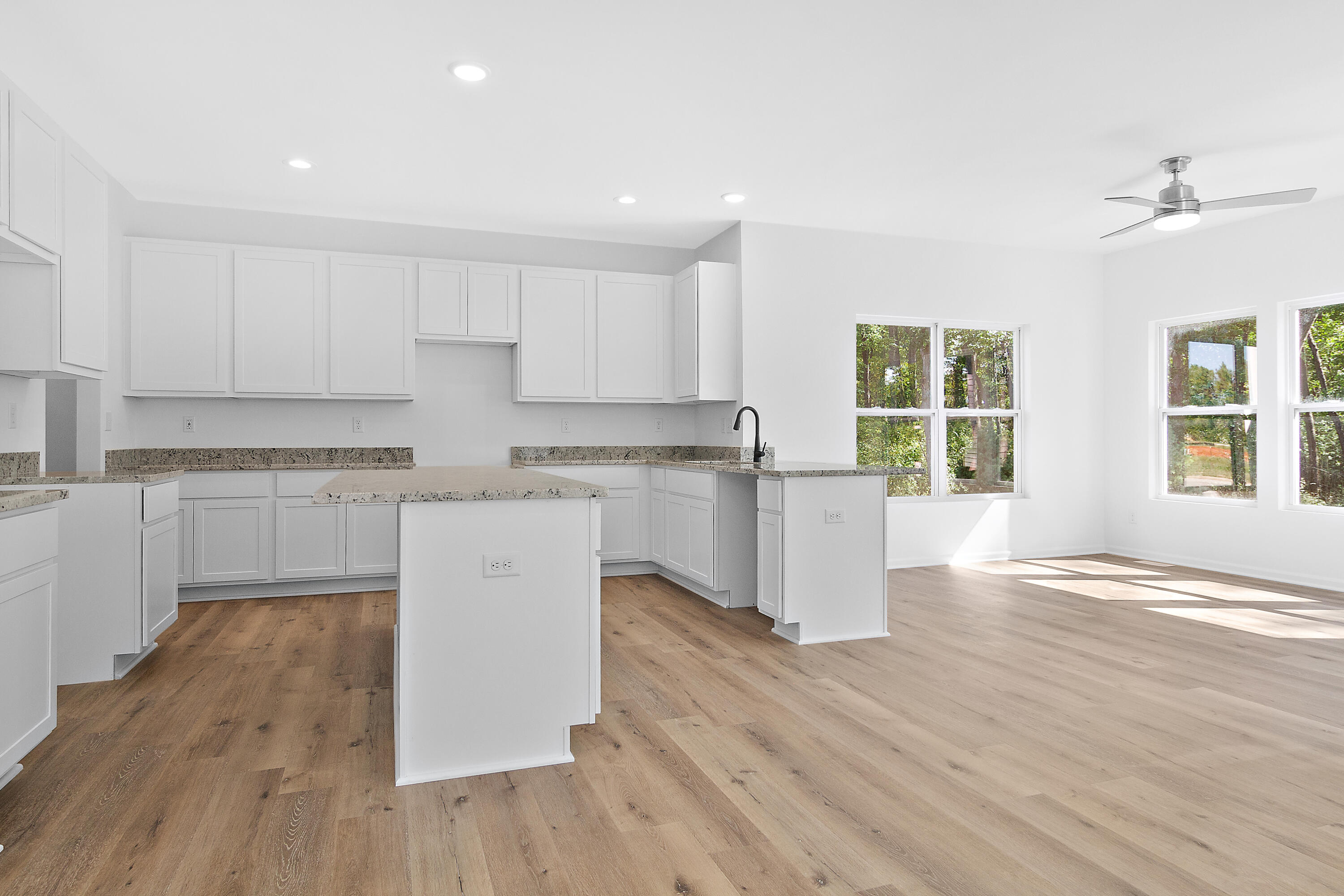 3111 Buck Lane Portage, IN 46368 - Photo 8 of 24 a kitchen with wooden floors and white appliances
