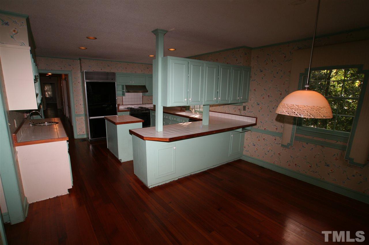 1304 Marlowe Road Raleigh, NC 27609 - Photo 11 of 21 a kitchen with sink and cabinets