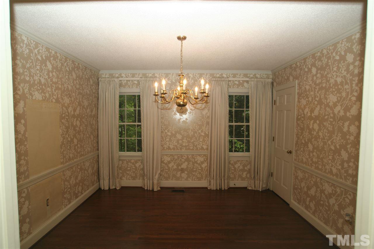 1304 Marlowe Road Raleigh, NC 27609 - Photo 12 of 21 a view of a livingroom with a chandelier fan and windows
