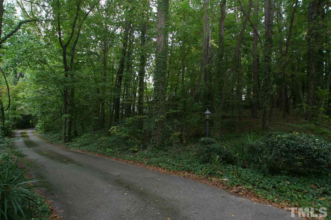 1304 Marlowe Road Raleigh, NC 27609 - Photo 18 of 21 a view of a forest with a street