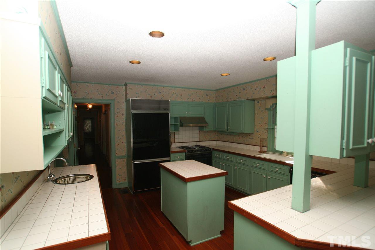 1304 Marlowe Road Raleigh, NC 27609 - Photo 3 of 21 a kitchen with sink and refrigerator