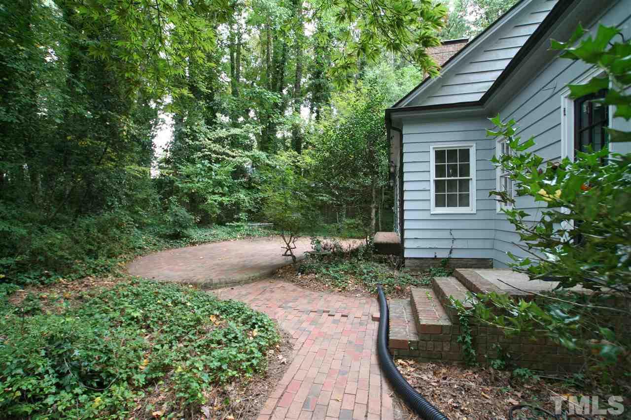 1304 Marlowe Road Raleigh, NC 27609 - Photo 4 of 21 a backyard of a house with lots of green space