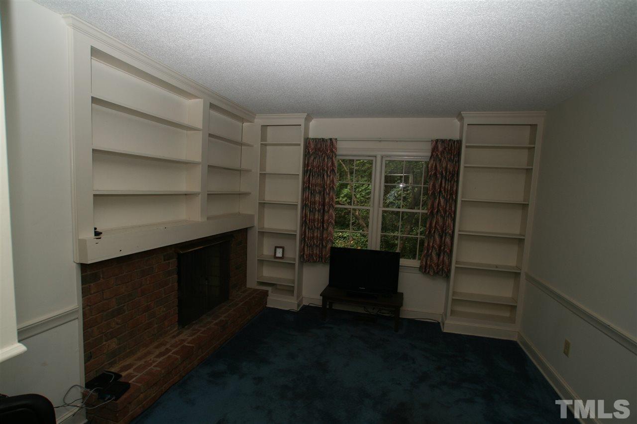 1304 Marlowe Road Raleigh, NC 27609 - Photo 6 of 21 a room with a furniture and a fireplace