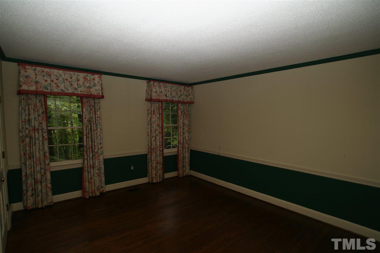 1304 Marlowe Road Raleigh, NC 27609 - Photo 7 of 21 wooden floor in an empty room with a window