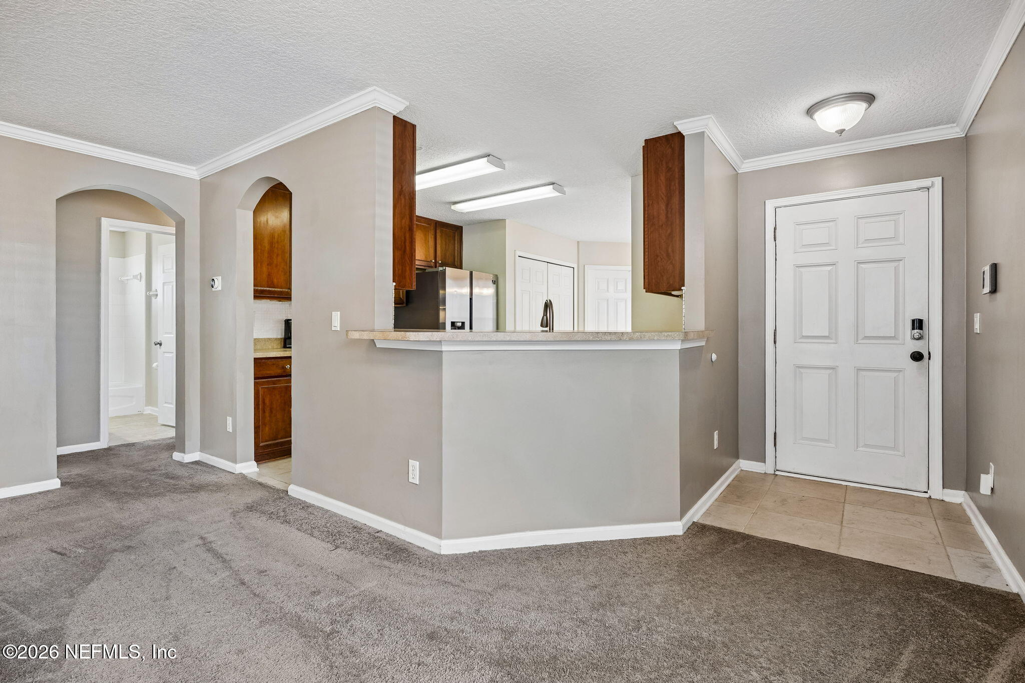 96712 Commodore Point Drive Yulee, FL 32097 - Photo 3 of 24 an entryway with a bedroom