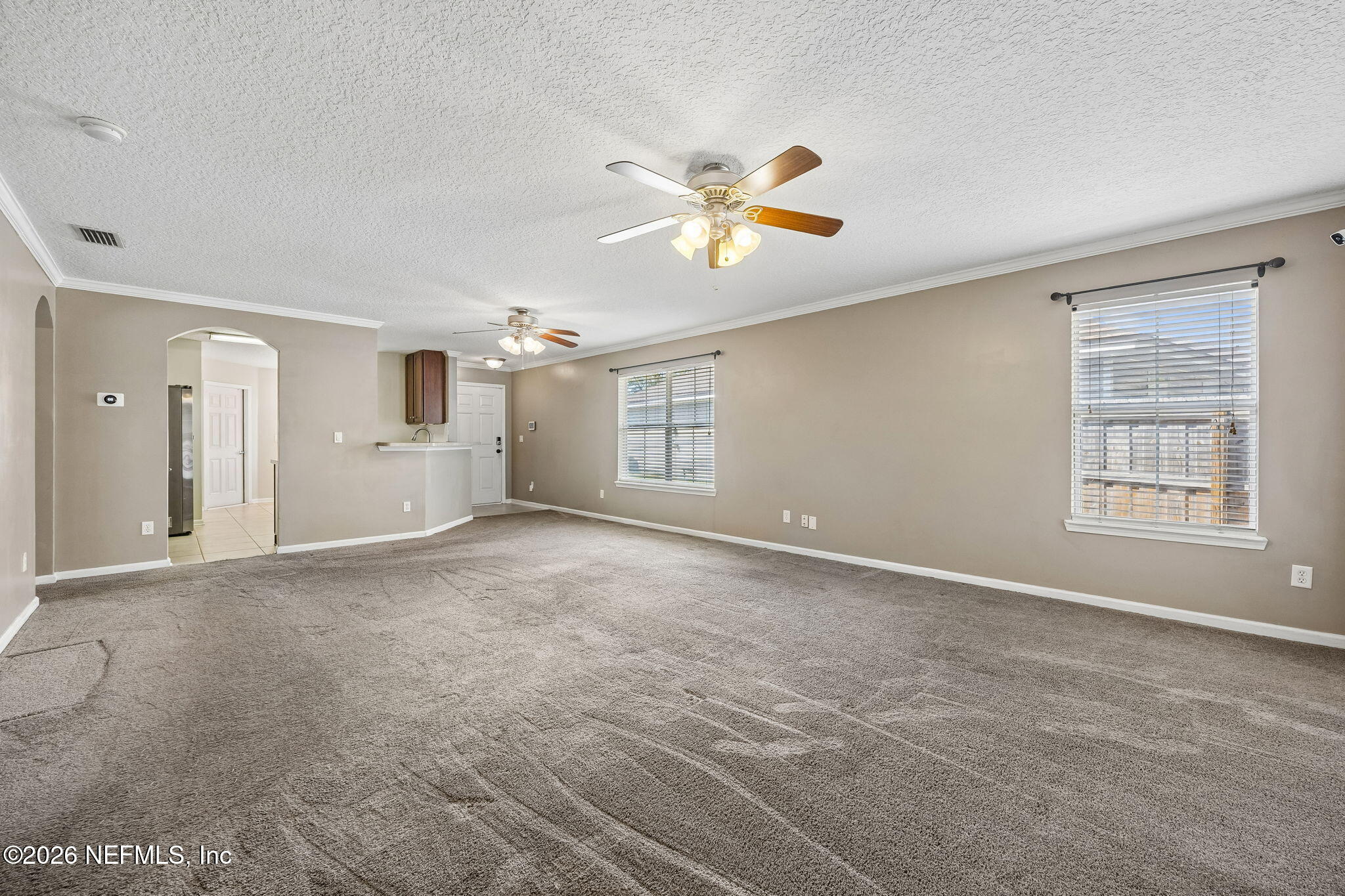96712 Commodore Point Drive Yulee, FL 32097 - Photo 5 of 24 a view of an empty room with a window