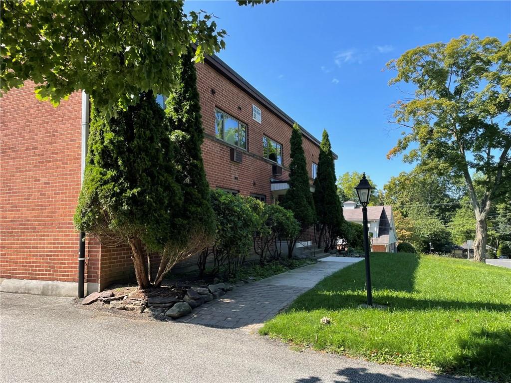 40 South Middletown Road, Unit 4 Pearl River, NY 10965 - Photo 1 of 1 View of side of home featuring a lawn