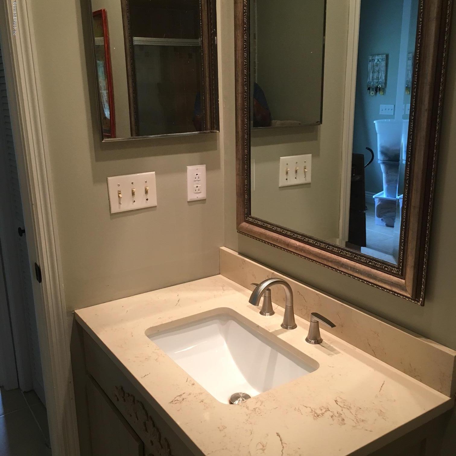 1441 Satsuma Road St. Johns, FL 32259 - Photo 12 of 45 a bathroom with a sink and a mirror