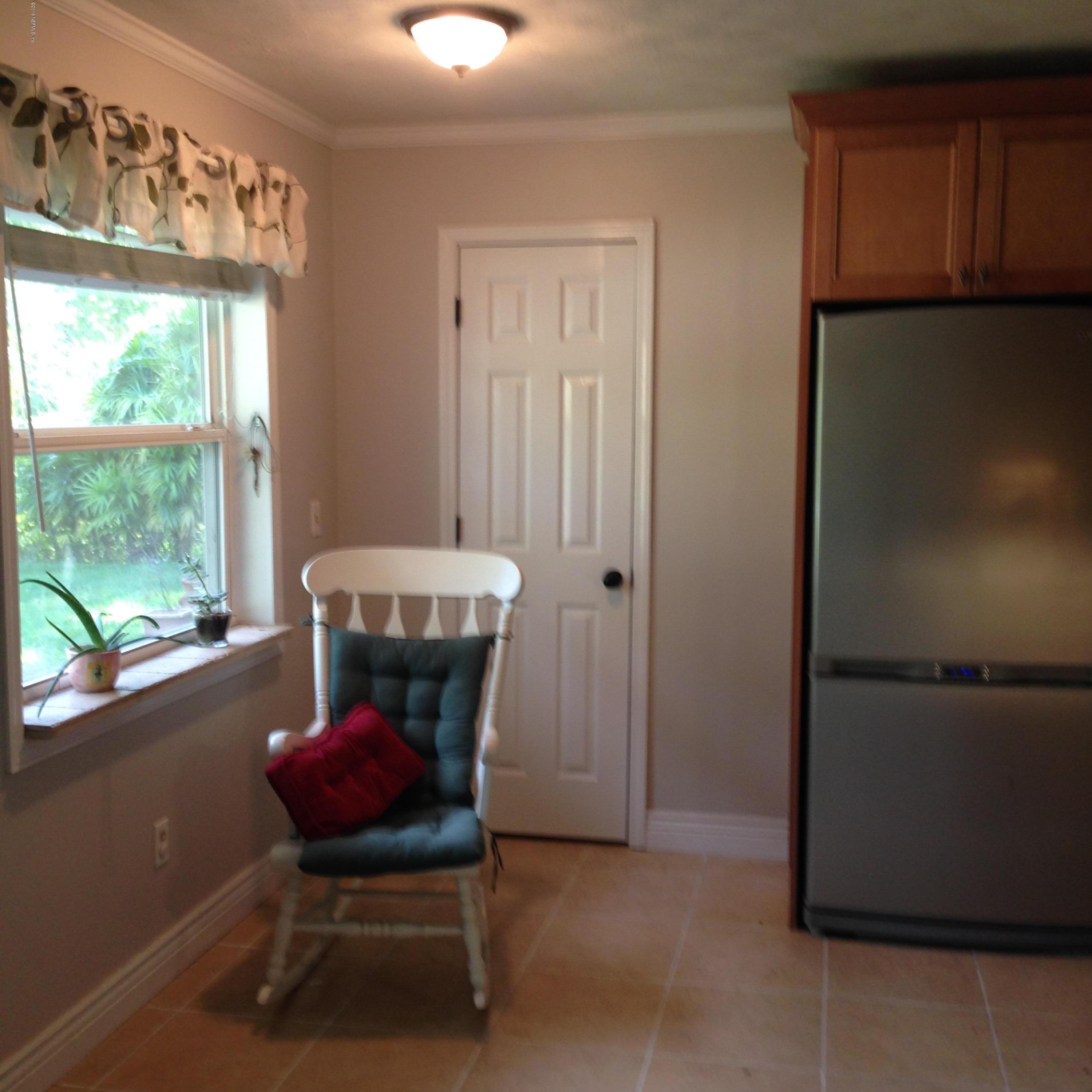 1441 Satsuma Road St. Johns, FL 32259 - Photo 17 of 45 a chair and a table in a room