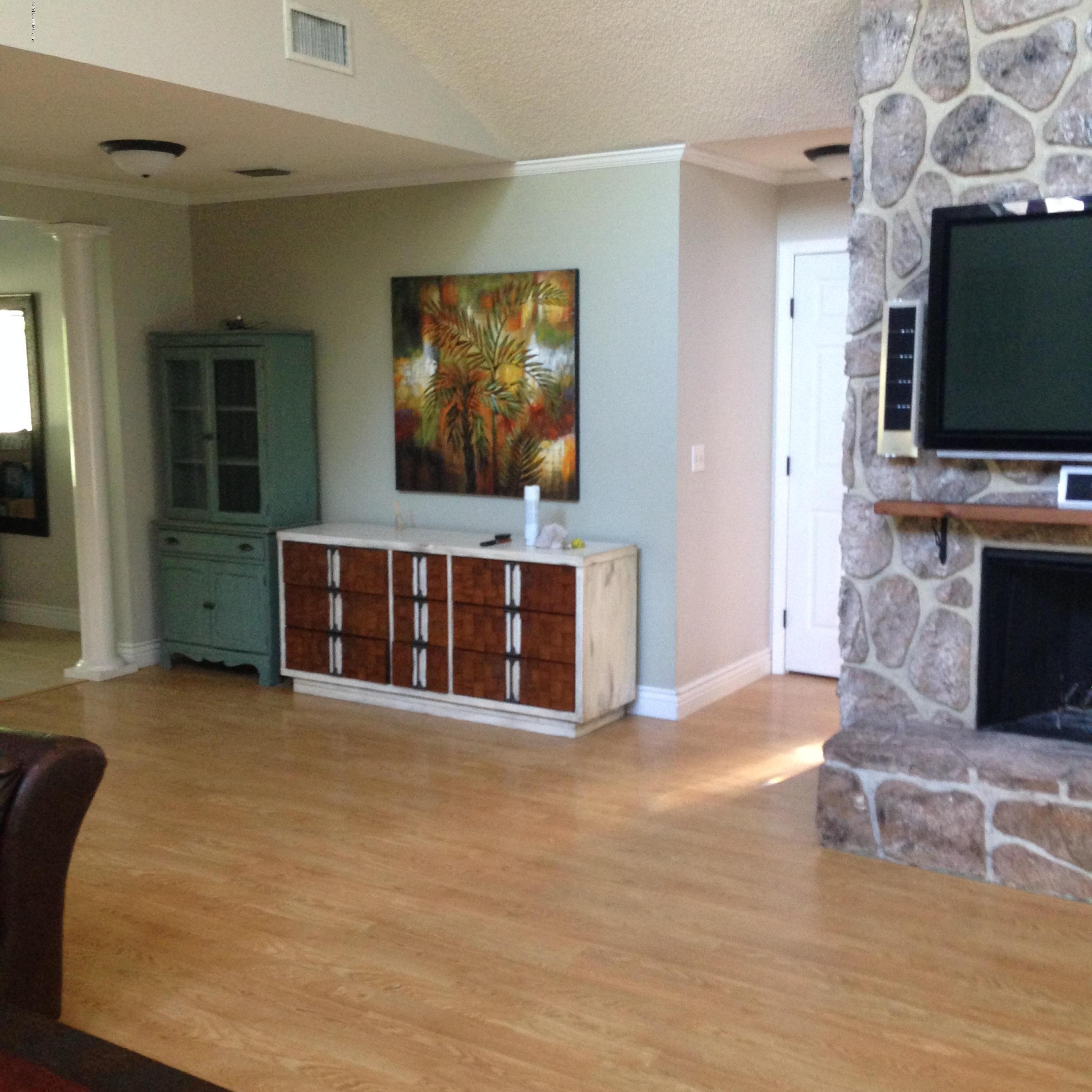 1441 Satsuma Road St. Johns, FL 32259 - Photo 19 of 45 a view of a livingroom with furniture and a flat screen tv