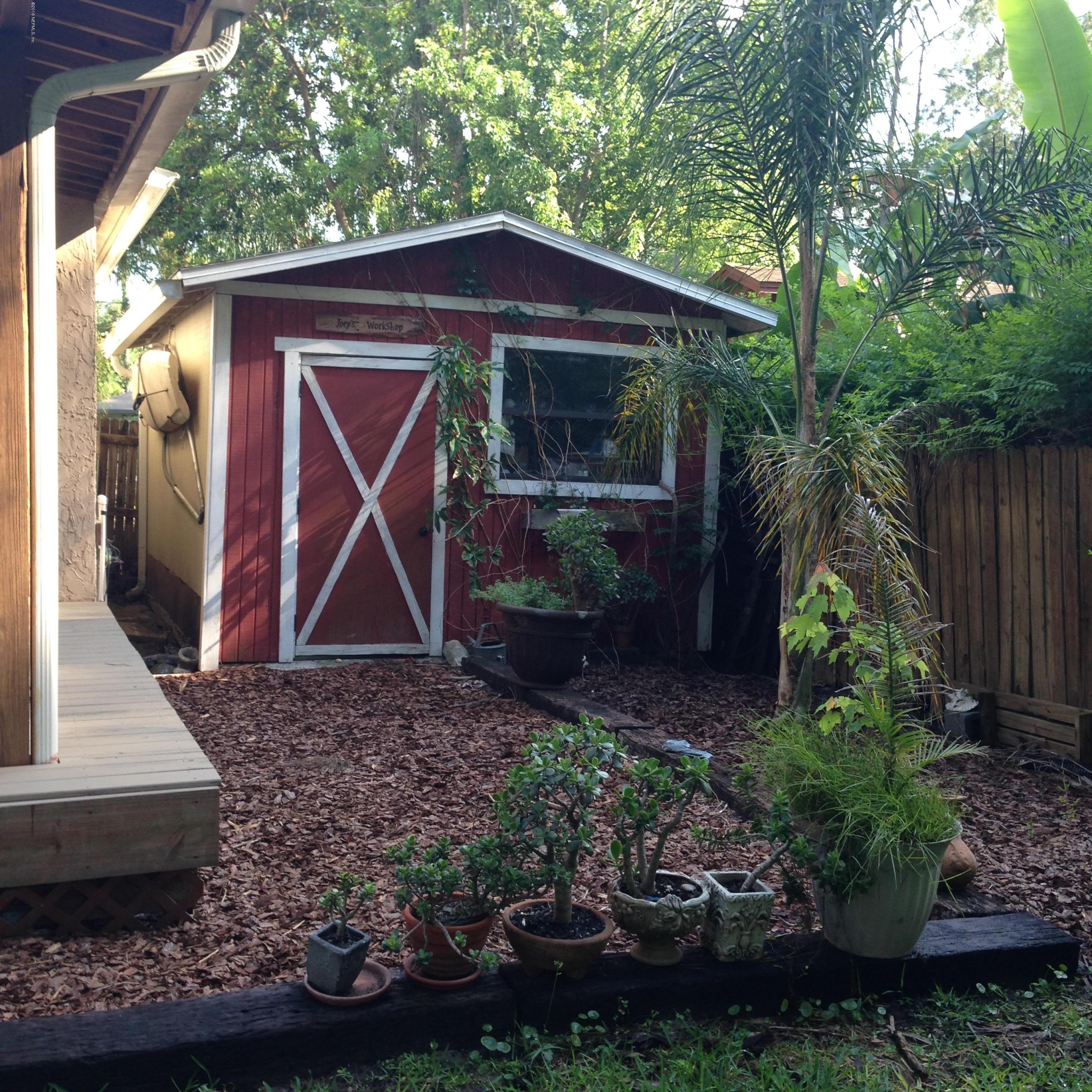 1441 Satsuma Road St. Johns, FL 32259 - Photo 21 of 45 a front view of a house with garden