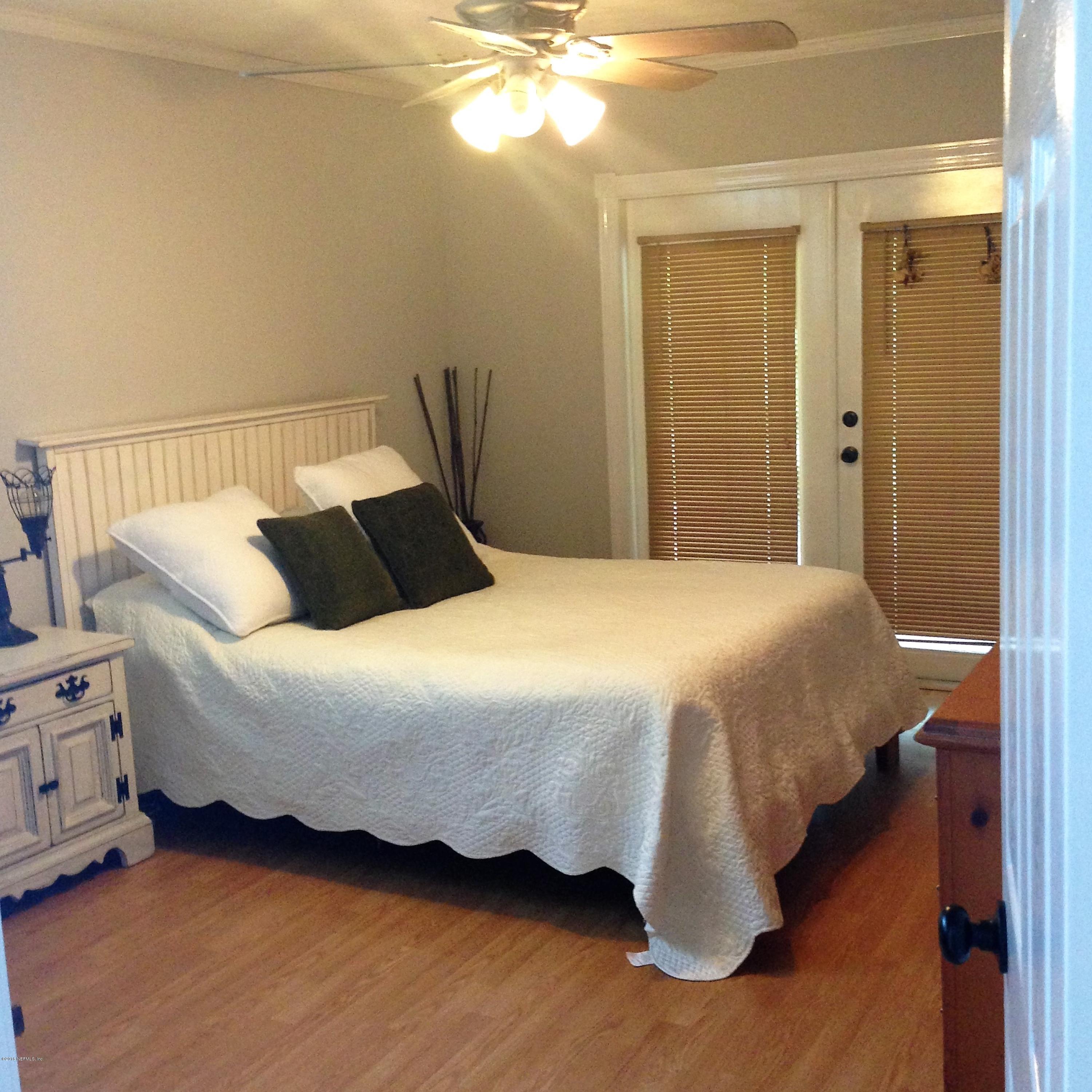 1441 Satsuma Road St. Johns, FL 32259 - Photo 28 of 45 a bedroom with a bed and window