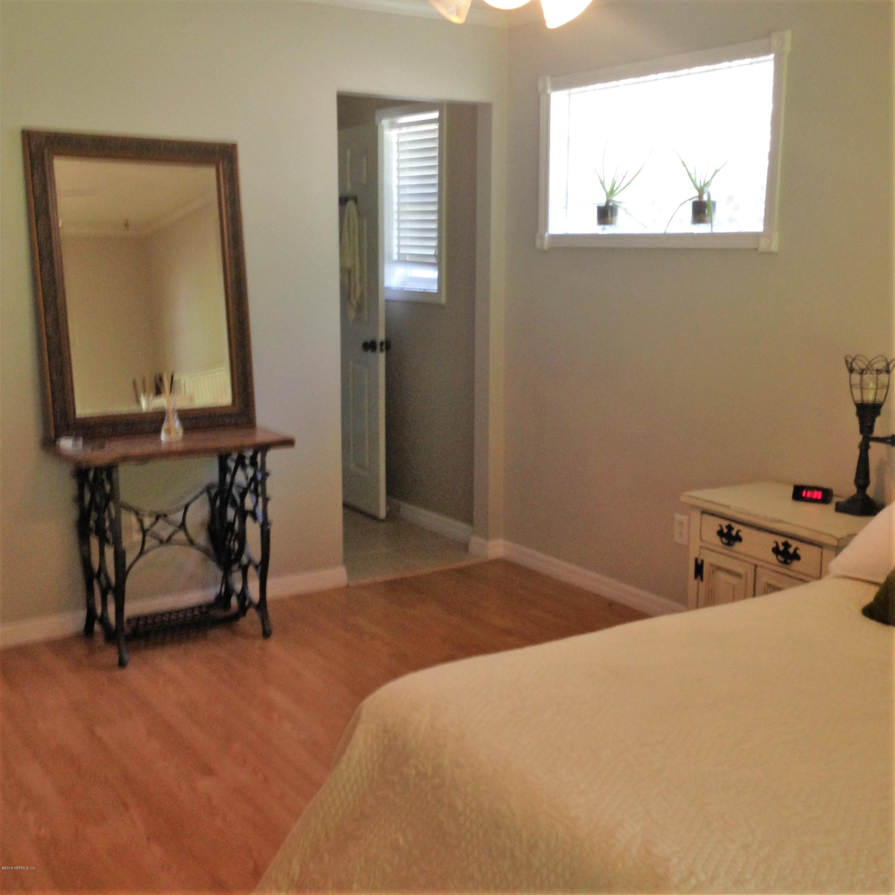 1441 Satsuma Road St. Johns, FL 32259 - Photo 29 of 45 a bedroom with bed and a window