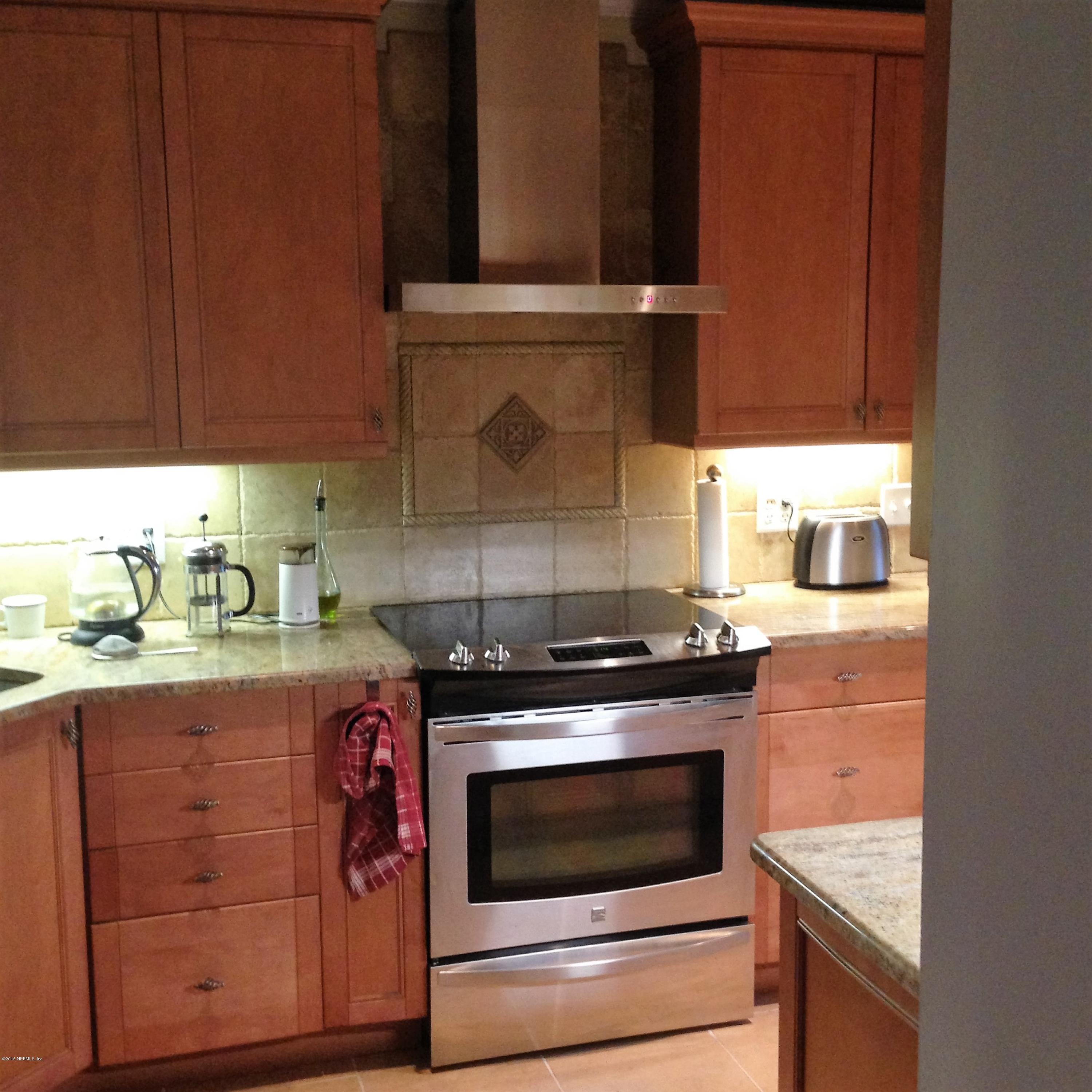 1441 Satsuma Road St. Johns, FL 32259 - Photo 32 of 45 a stove top oven sitting inside of a kitchen