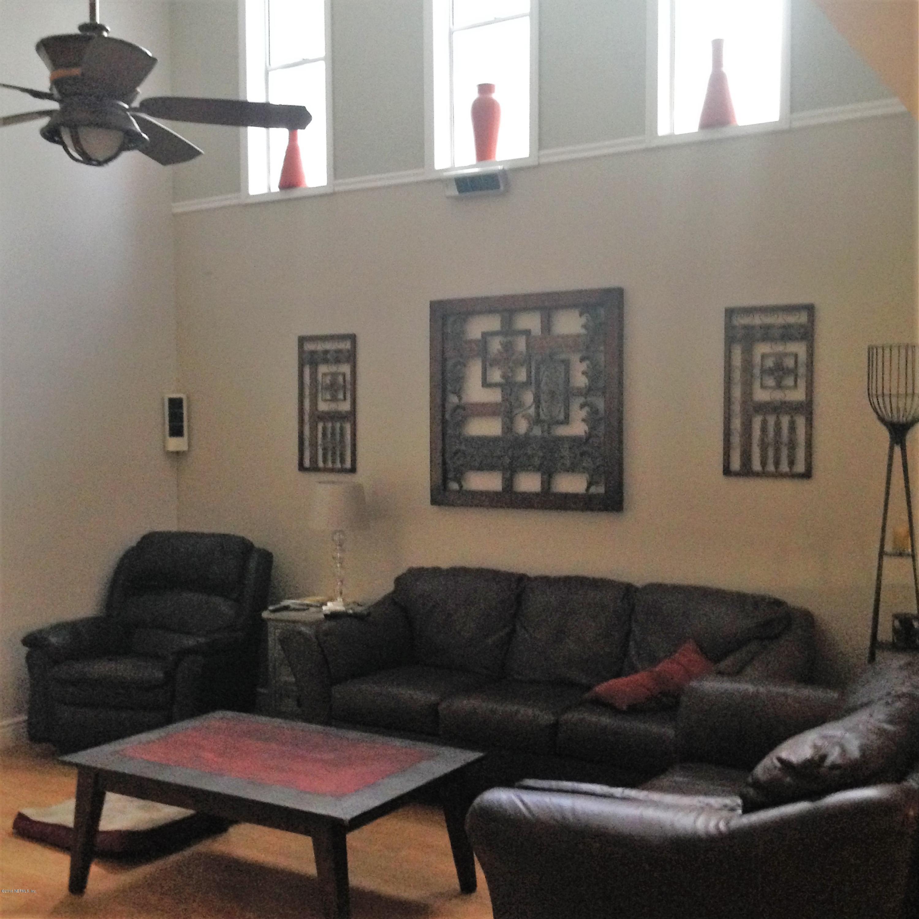 1441 Satsuma Road St. Johns, FL 32259 - Photo 35 of 45 a living room with furniture a couch and a window