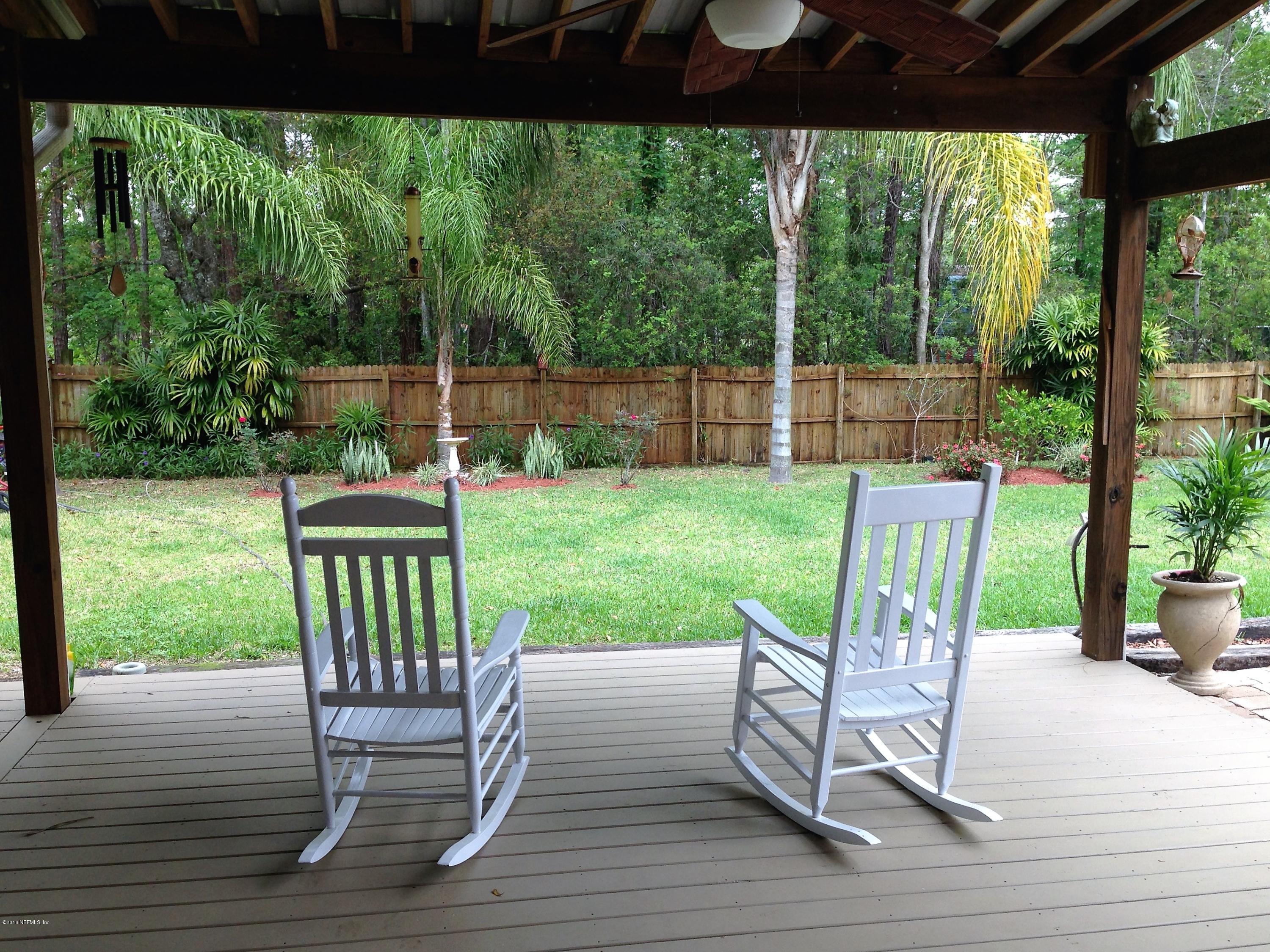 1441 Satsuma Road St. Johns, FL 32259 - Photo 4 of 45 a view of a chair and tables in the patio