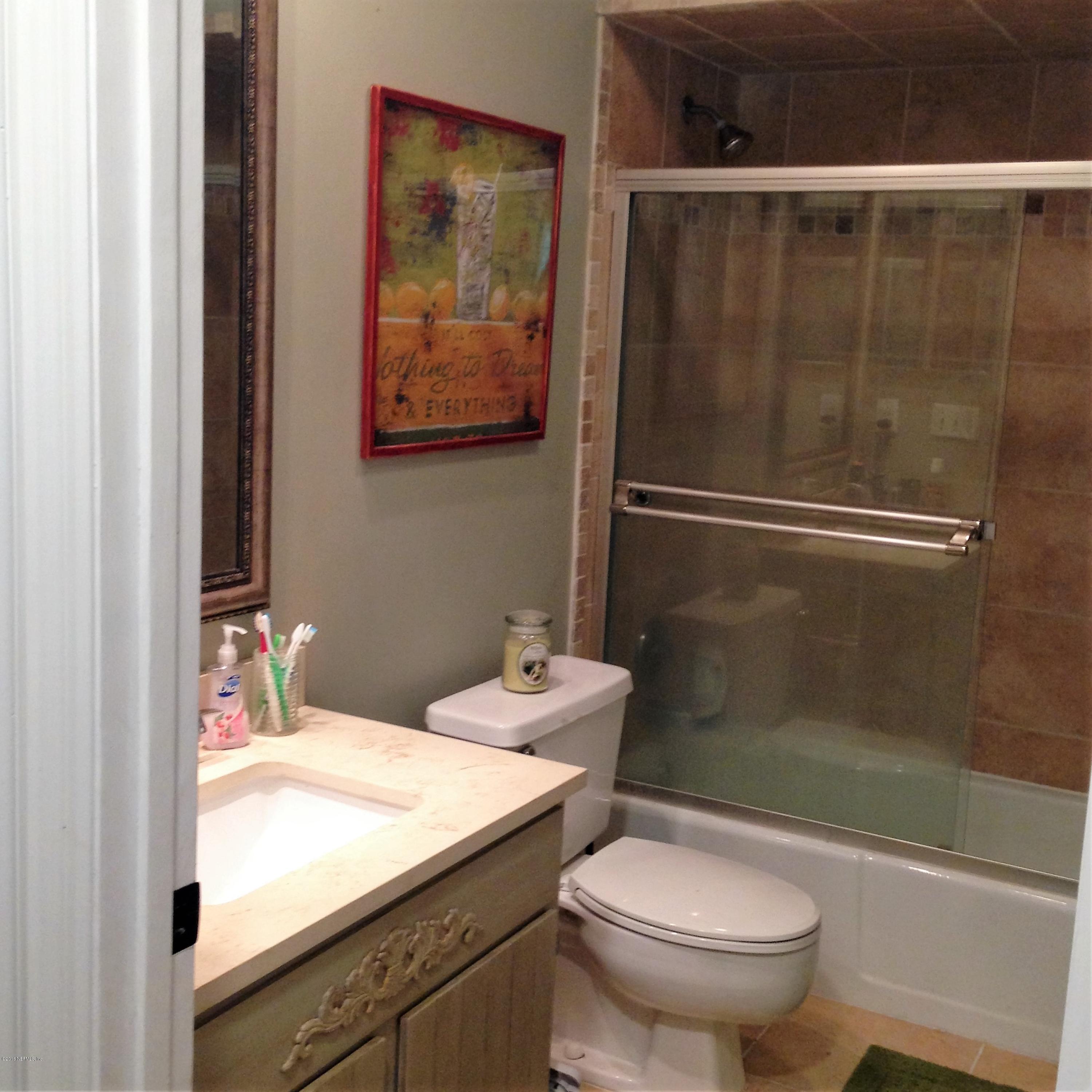 1441 Satsuma Road St. Johns, FL 32259 - Photo 42 of 45 a bathroom with a sink a toilet and shower