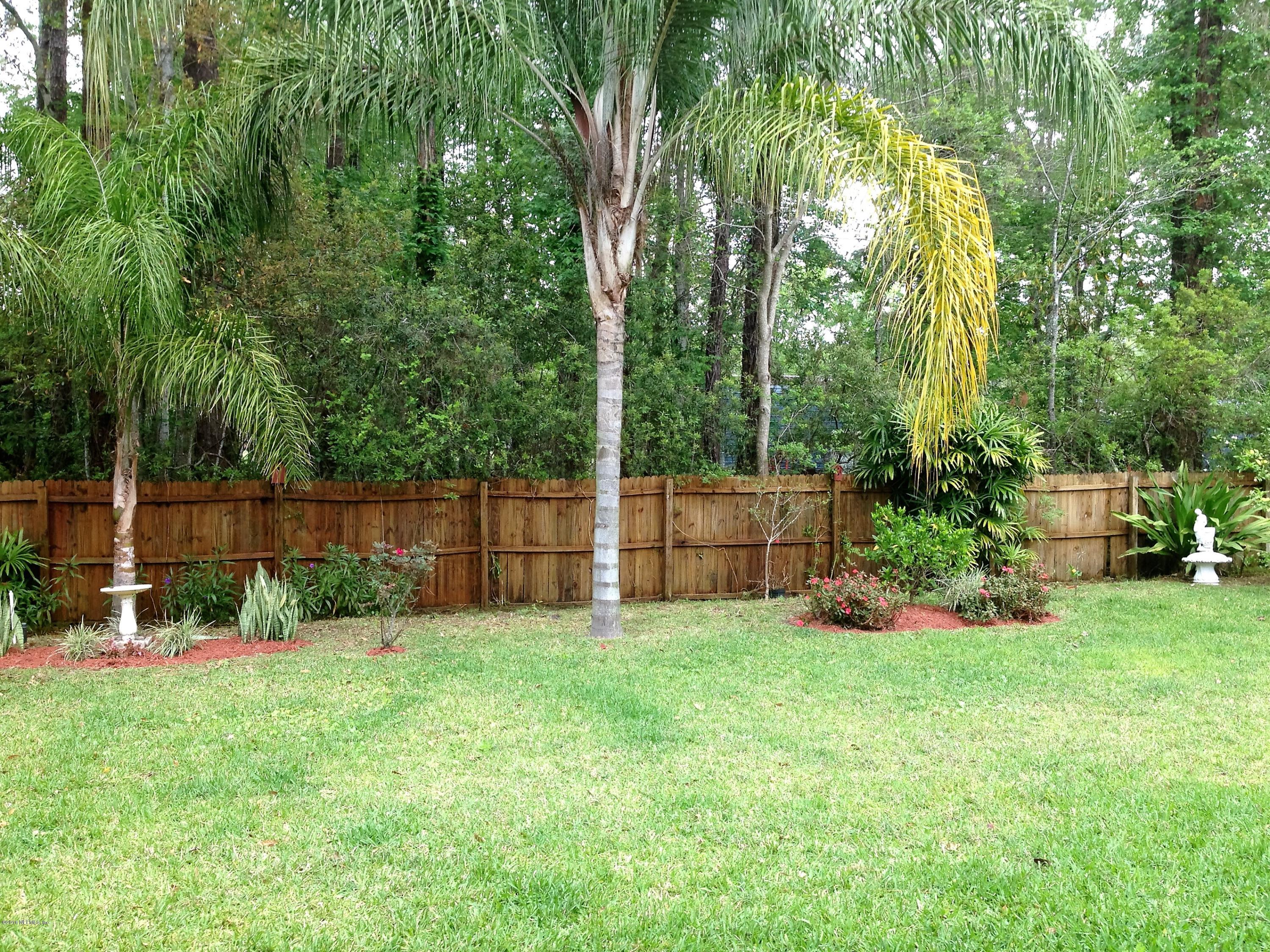 1441 Satsuma Road St. Johns, FL 32259 - Photo 5 of 45 a view of a backyard with swings