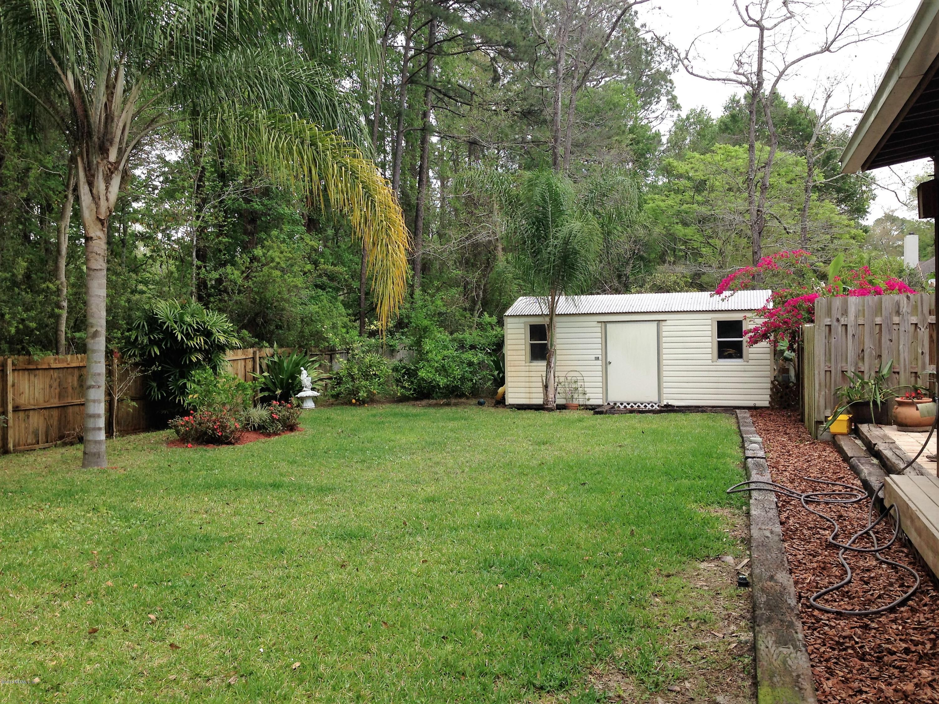 1441 Satsuma Road St. Johns, FL 32259 - Photo 6 of 45 a view of a white house with a yard and sitting area