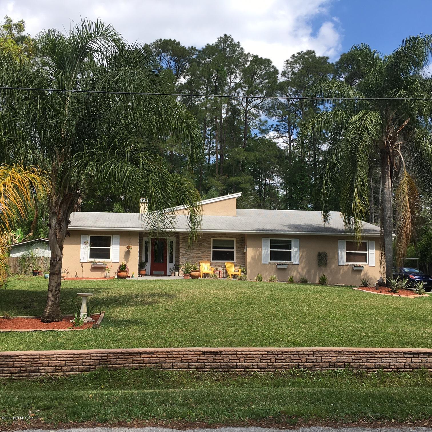 1441 Satsuma Road St. Johns, FL 32259 - Photo 7 of 45 a front view of a house with a yard