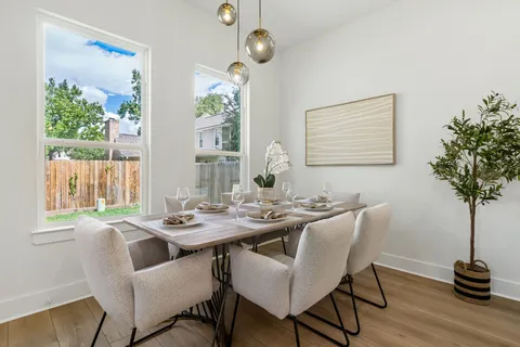 a view of a dining room with furniture window and outside view