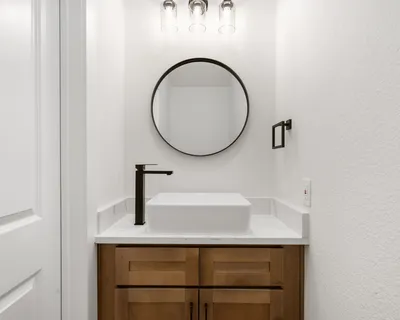 a bathroom with a sink and a mirror