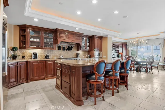 a living room with fireplace furniture and a large window