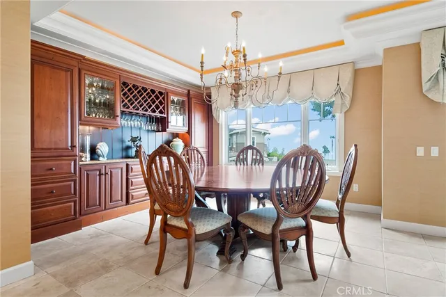 a view of a patio with table and chairs and potted plants