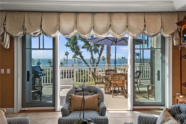a view of a patio with a table and chairs