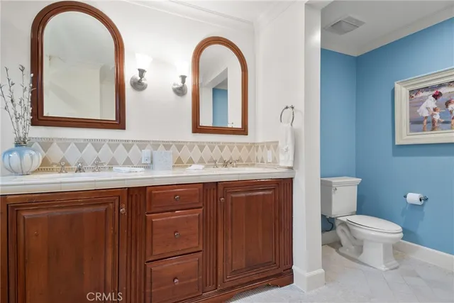 a bedroom with a bed and a fireplace