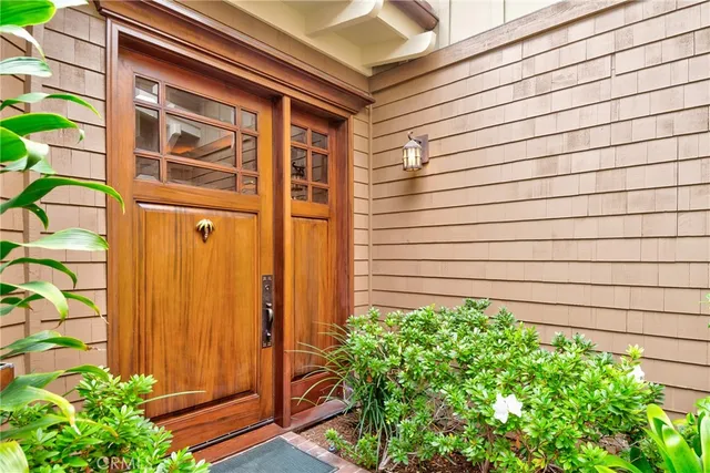 a view of a hallway with living room and dining room view
