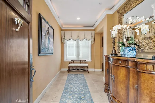 a view of a hallway with living room and dining room view