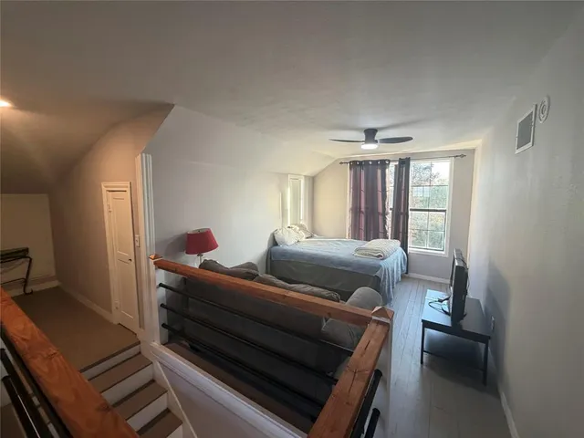 a bedroom with furniture and window