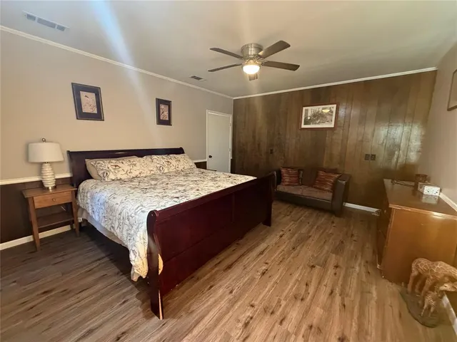 a bed room with a bed and a chandelier