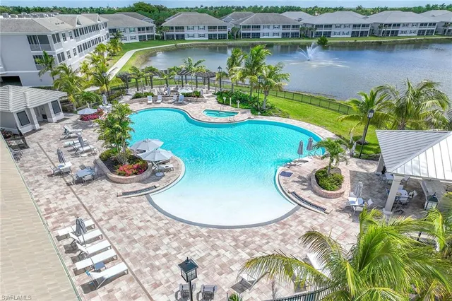 an aerial view of a house with a lake view